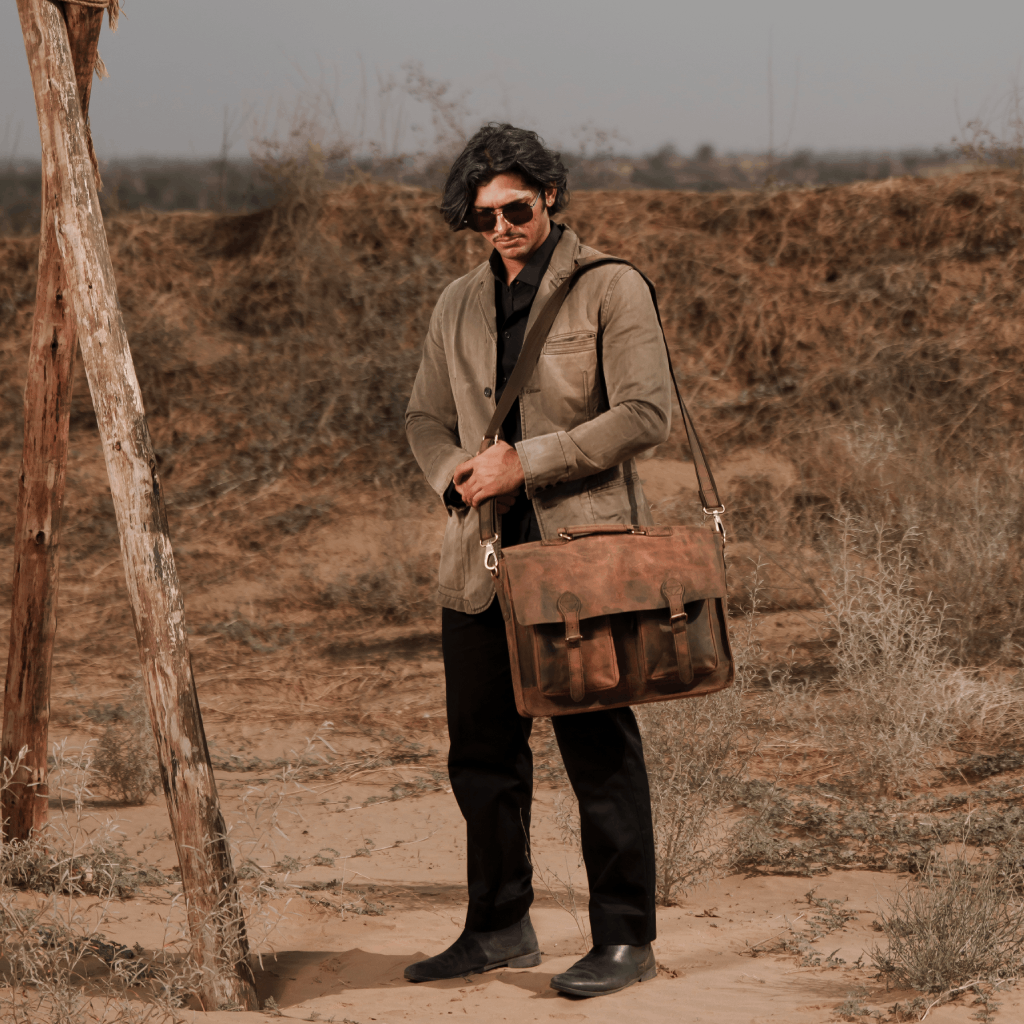 Havynhide Adani brown full-grain leather messenger bag being carried