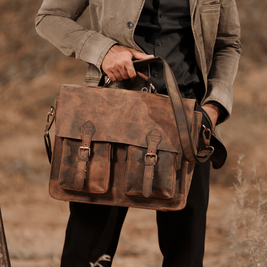 Person carrying Havynhide Adani full-grain leather messenger bag
