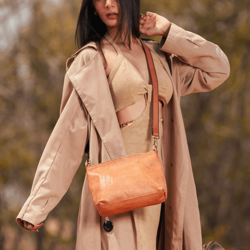 Woman carrying Havynhide Alia full grain leather crossbody bag
