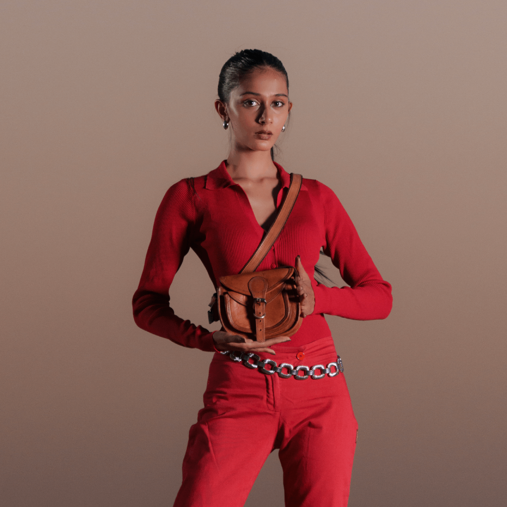 Woman wearing Havynhide Kiara brown leather crossbody bag