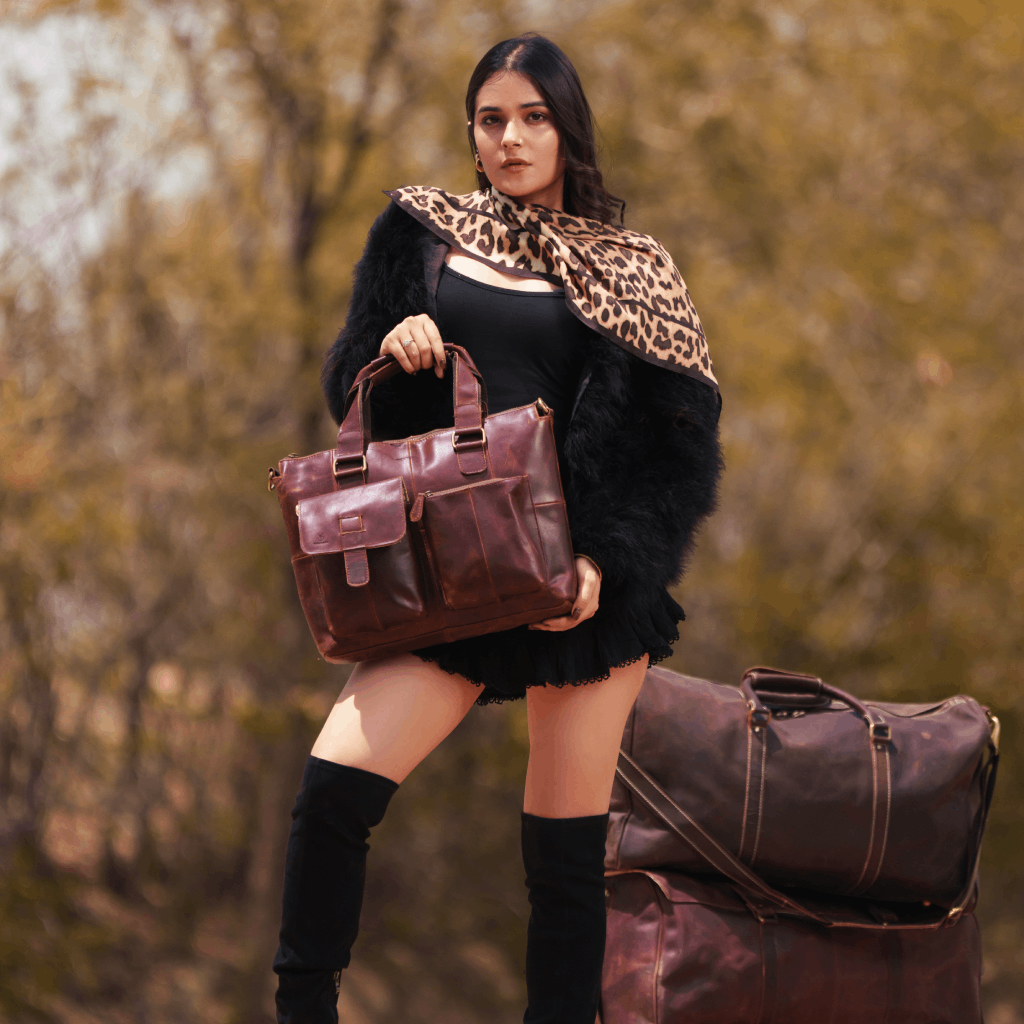 Woman carrying Havynhide Naik brown leather messenger bag