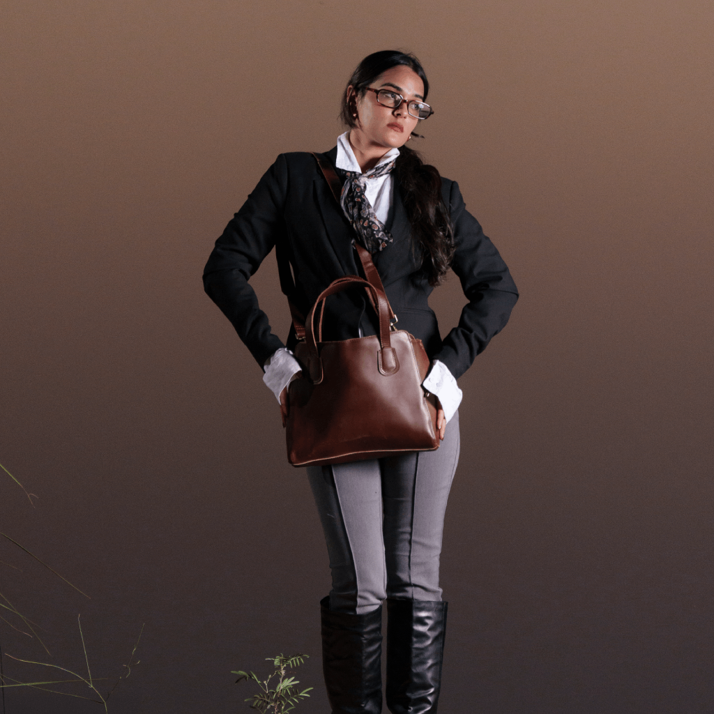 Woman carrying Havynhide Rekha full-grain leather tote bag
