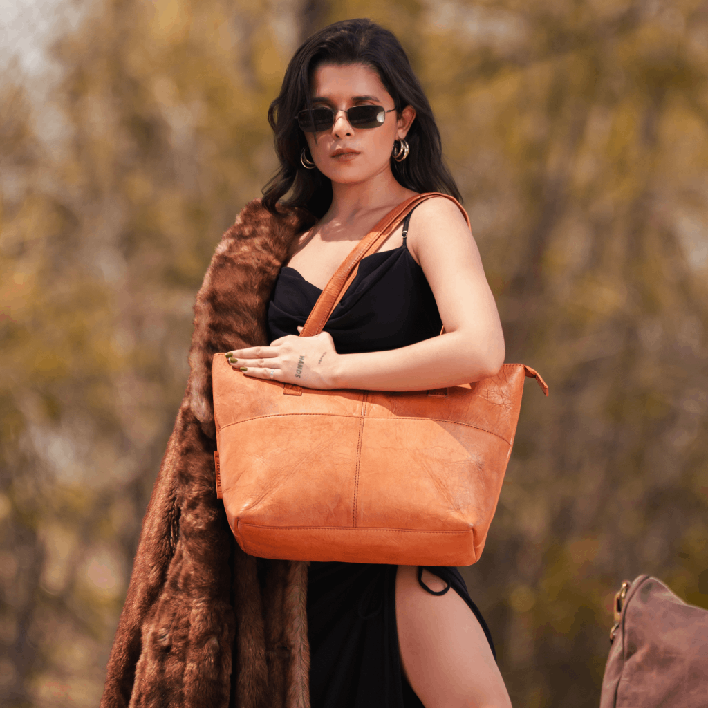 Woman carrying Havynhide Sridevi full-grain leather tote bag